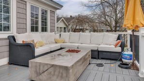 A covered outdoor seating area with a sectional sofa, a coffee table, and a gas grill. - 1 Mi to Drakes Island Beach: Cottage w/ Deck! (Wells)