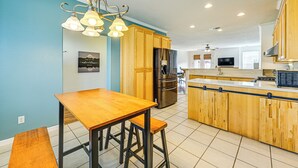 A modern kitchen with wooden cabinets, stainless steel appliances, and a central island. - 26 Mi to Fresno: Pet-friendly Home in Reedley! (Reedley)
