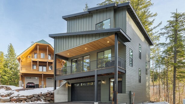 A two-story modern house with a balcony, large windows, and a garage. - cabin, hot tub! 3rd night free stay before 9/8/26 (Government Camp)