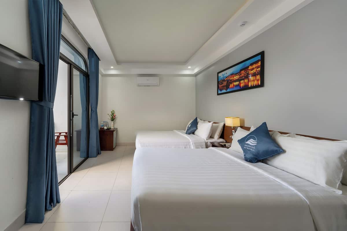 A hotel room with two beds, a flat-screen TV, a painting, and a sliding glass door.