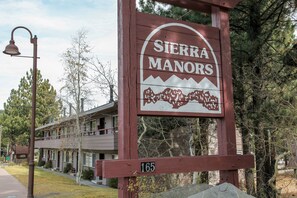 A sign for Sierra Manors with a mountain graphic and the number 165. - Sierra Manors #61 2 Bedroom Condo (Mammoth Lakes)