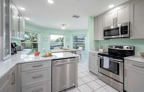 Prepare meals in the well-lit kitchen with ample counter space and modern appliances.