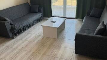 Standard Room, 1 Bedroom, Smoking | Living area | 106-cm LCD TV with satellite channels, heated floors
