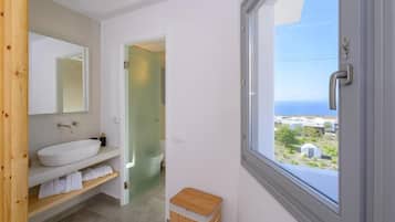 Deluxe Suite, Sea View | Bathroom | Hair dryer, bathrobes, towels, toilet paper