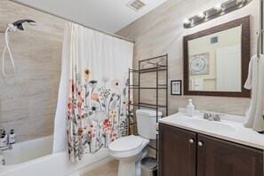 Shower, hair dryer, towels, shampoo