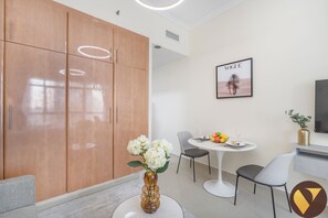 Luxury Apartment, Lake View | Living area | 65-inch Smart TV with cable channels - Vogue | Lake City Tower JLT near Marina | JBR (Dubai)