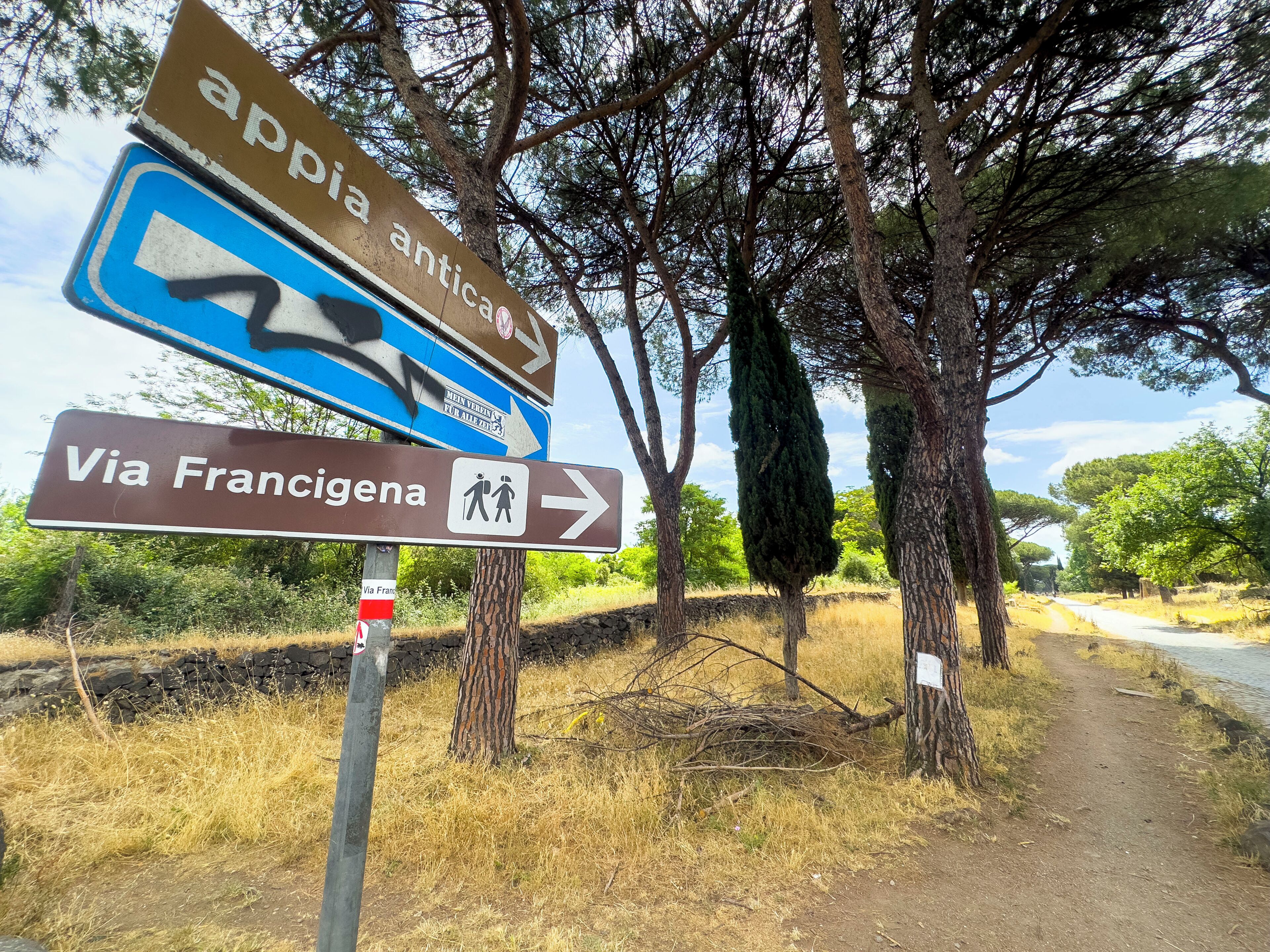 Directional signs for Via Francigena and Appia Antica.