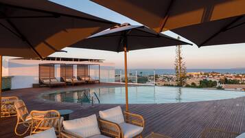 Indoor pool, 2 outdoor pools, open 8:00 AM to 8:00 PM, pool umbrellas