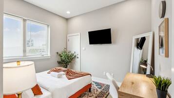 1 bedroom, desk, iron/ironing board, travel crib