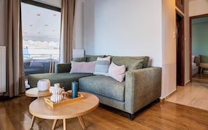 Apartment, Balcony, City View | Living room | 50-inch Smart TV with satellite channels, fireplace