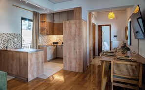 Apartment, Balcony, City View | Living area | 50-inch Smart TV with satellite channels, fireplace - Acropolis Penthouse Project (Athens)