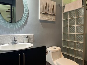 Shower, hair dryer, towels, toilet paper