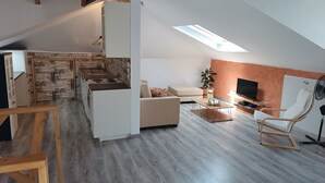 A modern loft apartment with a kitchen, living area, and dining space. - ATH AIRPORT LOFT PAIANIA (Peania)