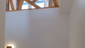 A staircase with three steps, each illuminated by a square wall-mounted light fixture. - ATH AIRPORT LOFT PAIANIA (Peania)