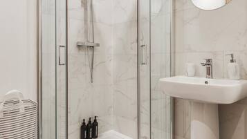 Shower, hair dryer, towels, soap