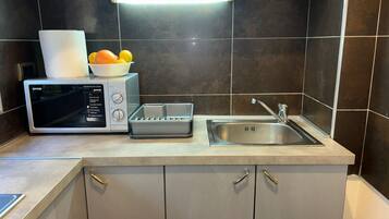 Standard Apartment, City View | Private kitchen | Espresso maker, coffee/tea maker, electric kettle
