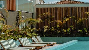 Outdoor pool, pool umbrellas, sun loungers