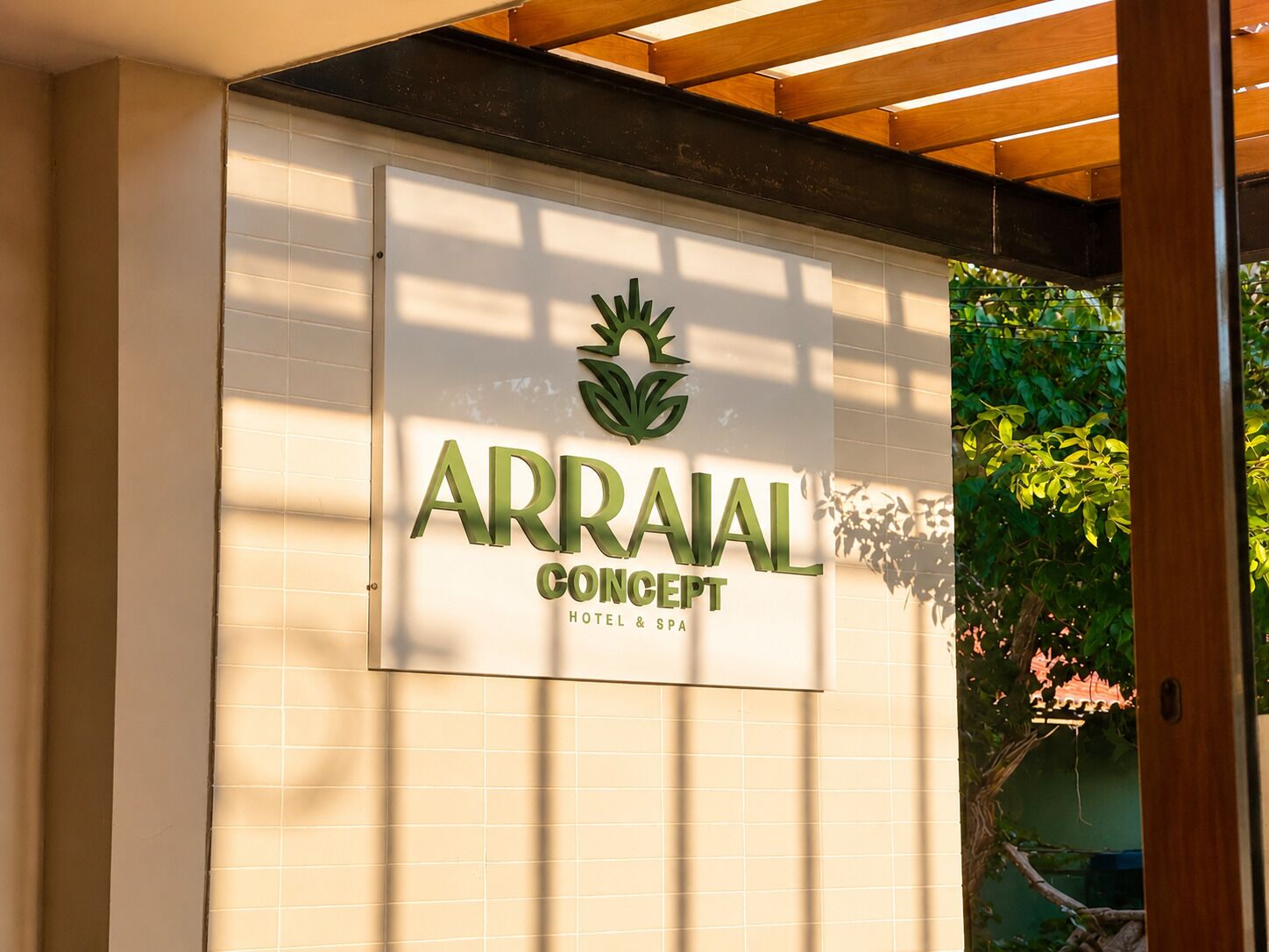 A hotel sign with a logo and the name 'ARRAAL CONCEPT HOTEL & SPA'.