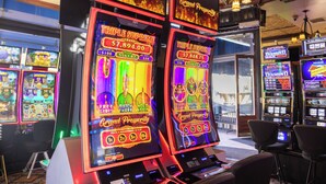 A casino with slot machines and a sign reading "Grand Prosperity". - Colorado Grande Casino (Cripple Creek)