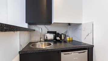 Fridge, microwave, stovetop, coffee/tea maker