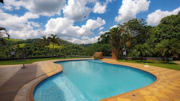 Outdoor pool, open 10:00 AM to 7:00 PM, pool umbrellas, pool loungers