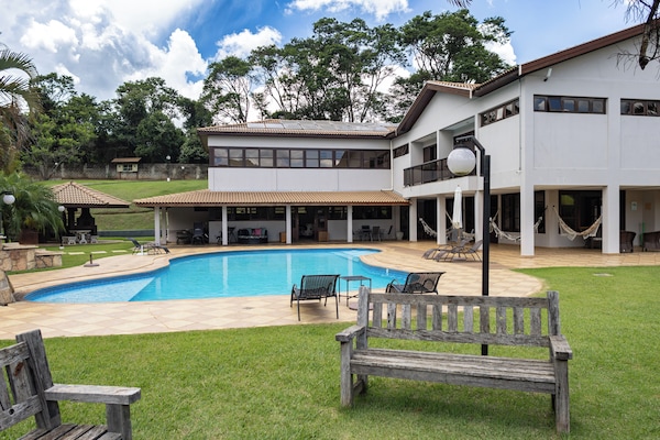 Outdoor pool, open 10:00 AM to 7:00 PM, pool umbrellas, pool loungers