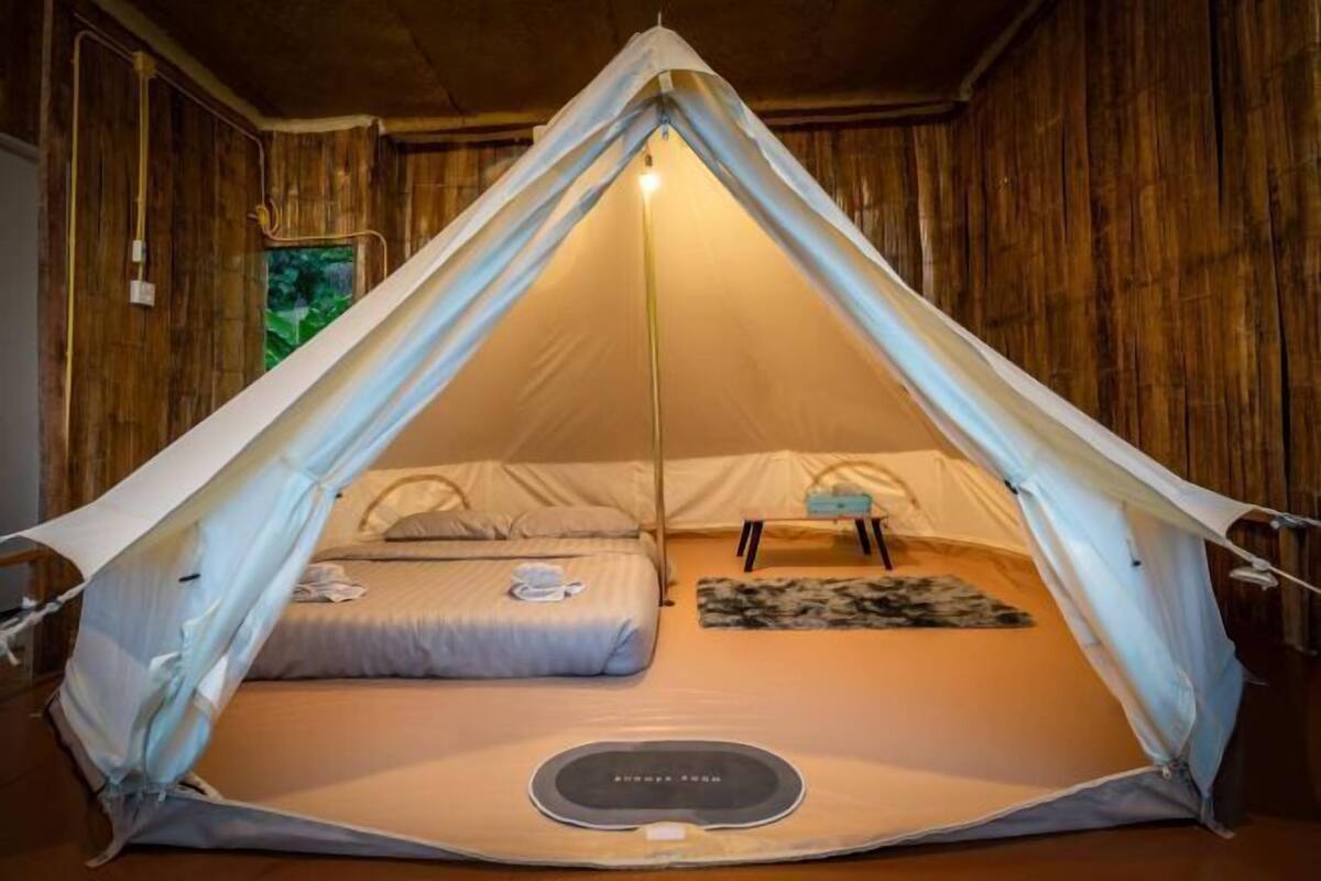Laptop workspace, bed sheets
