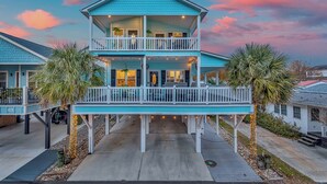A two-story house with a balcony, a porch, and a deck. - Ocean Lakes Walk to Beach! Waterpark! Arcade! Dogs Welcome! (Myrtle Beach)