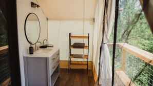 A small, compact room with a bunk bed, a sink, and a mirror. - The Richbourg, Lux Safari Tent (Cadiz)