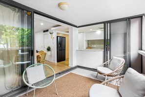 A modern interior with a dining area, kitchen, and seating space.