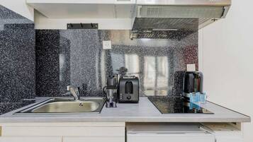 Fridge, microwave, stovetop, coffee/tea maker