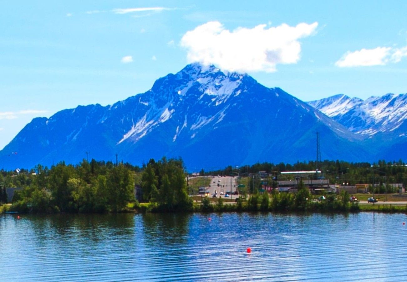 A lake with a mountain in the background.