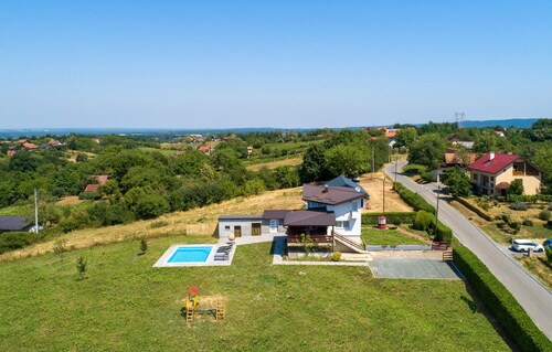 Modern home with pool and view