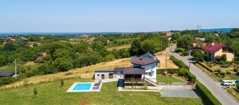 Modern home with pool and view
