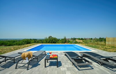 Modern home with pool and view
