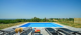 Modern home with pool and view