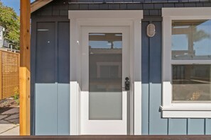 A building with a white door and a window.