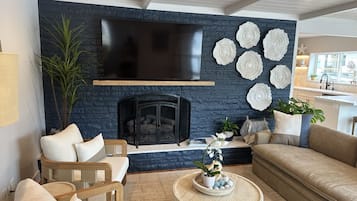 TV, fireplace, books