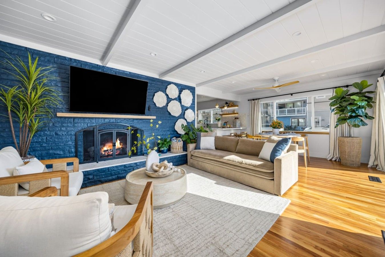 Living room with navy brick gas fireplace