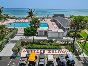 Relax by the pool at Nettles Island, where you can enjoy lounge chairs and umbrellas.