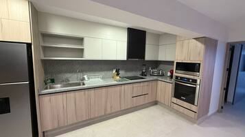 Coffee/tea maker, fridge, microwave, oven