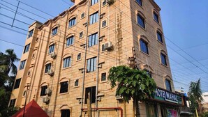 A multi-story hotel building with a prominent sign reading "HOTEL MAHAL". - Hotel Mahal & Restaurant (Kalyani)