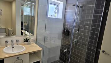 Shower, hair dryer, towels, soap