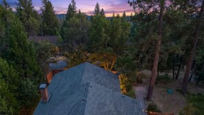 A house with a sloped roof, a deck with outdoor seating, and a hot tub. - Game Room - Hot Tub - Fire Pit - 25 min 2 Yosemite
EV Charger Level 2 (Oakhurst)