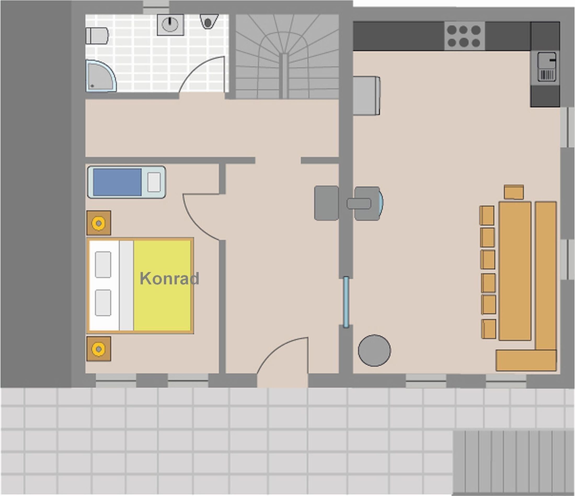 Distribución de una habitación de hotel con cama, baño, kitchenette y un pequeño rincón de descanso.