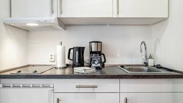 Fridge, stovetop, coffee/tea maker, electric kettle