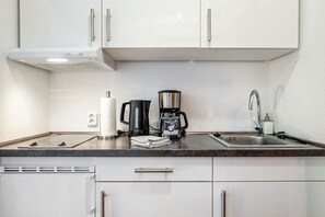 Fridge, stovetop, coffee/tea maker, electric kettle