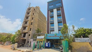 A multi-story building with a sign reading "Lord Krishna." - Hotel Lord Krishna Dham (Dwarka)