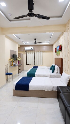 Deluxe Quadruple Room | Hypo-allergenic bedding available, desk, WiFi (free), bed sheets - Hotel Lord Krishna Dham (Dwarka)