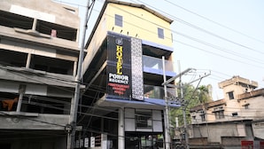 A hotel named "POHOR REGENCY HOTEL" with a signboard indicating it offers rooms, a restaurant, and a hall. - Hotel Pohor Regency Near Kamakhya Foot Bridge (Guwahati)